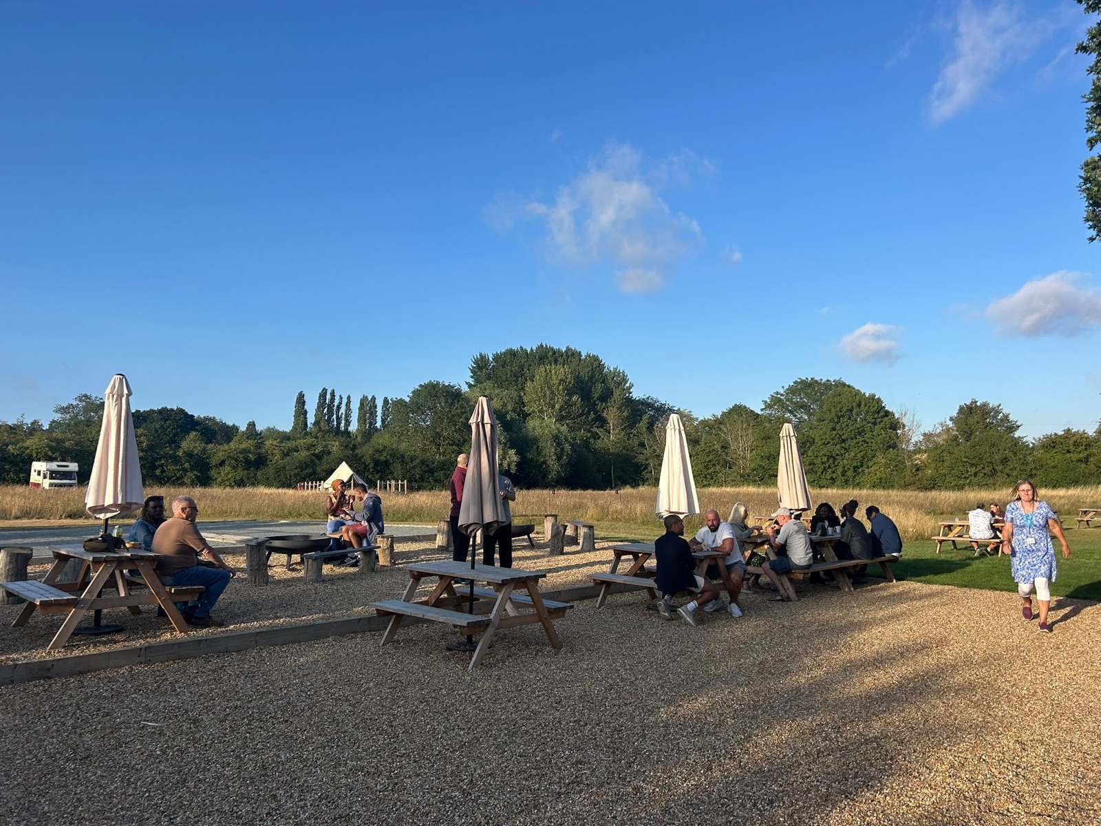 Picnic benches in the meadow at Flint Hall