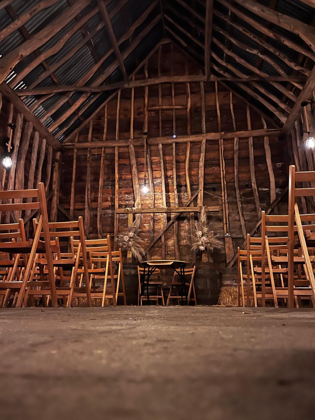 Inside the Barn at Flint Hall — view up to the timber roof